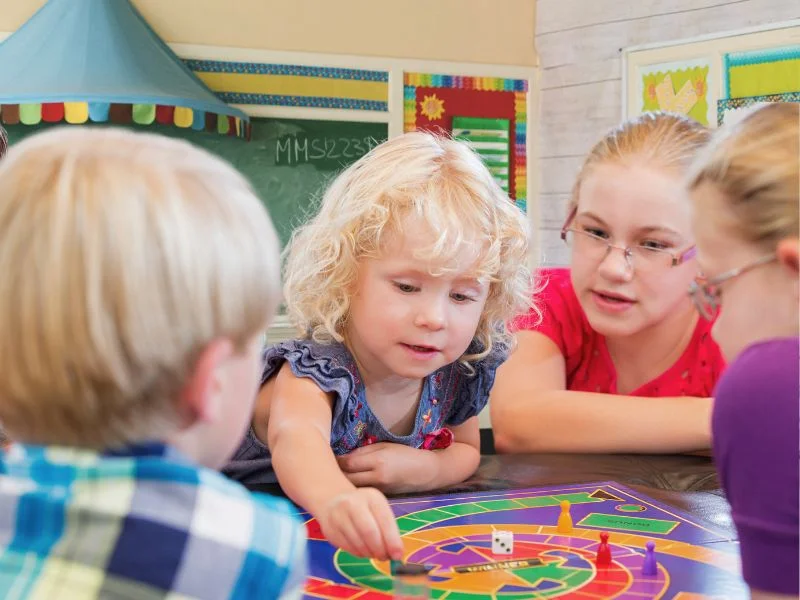 A monitor looking after children during the morning care service